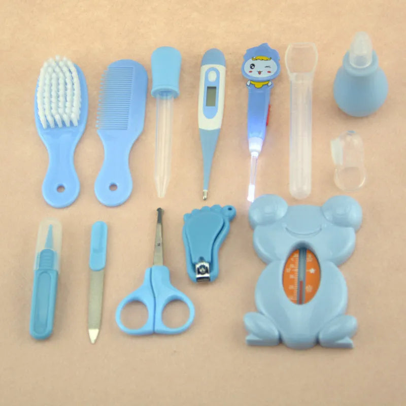 13-piece newborn baby care kit with pink grooming bag containing thermometer, scissors, brush, comb, nail clipper, and medicine tools