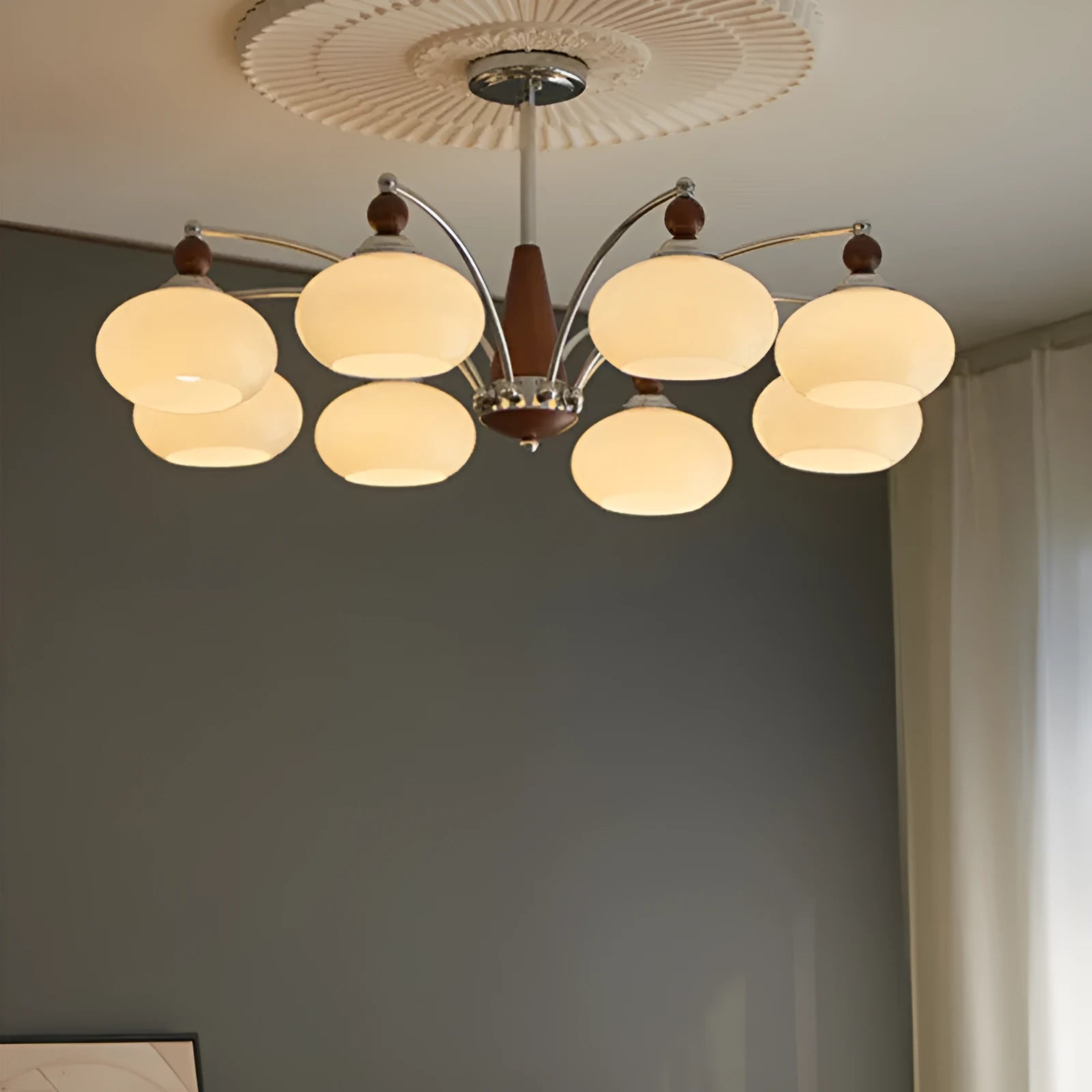 Creative persimmon glass and chrome chandelier with multiple light heads in Middle Ancient style.