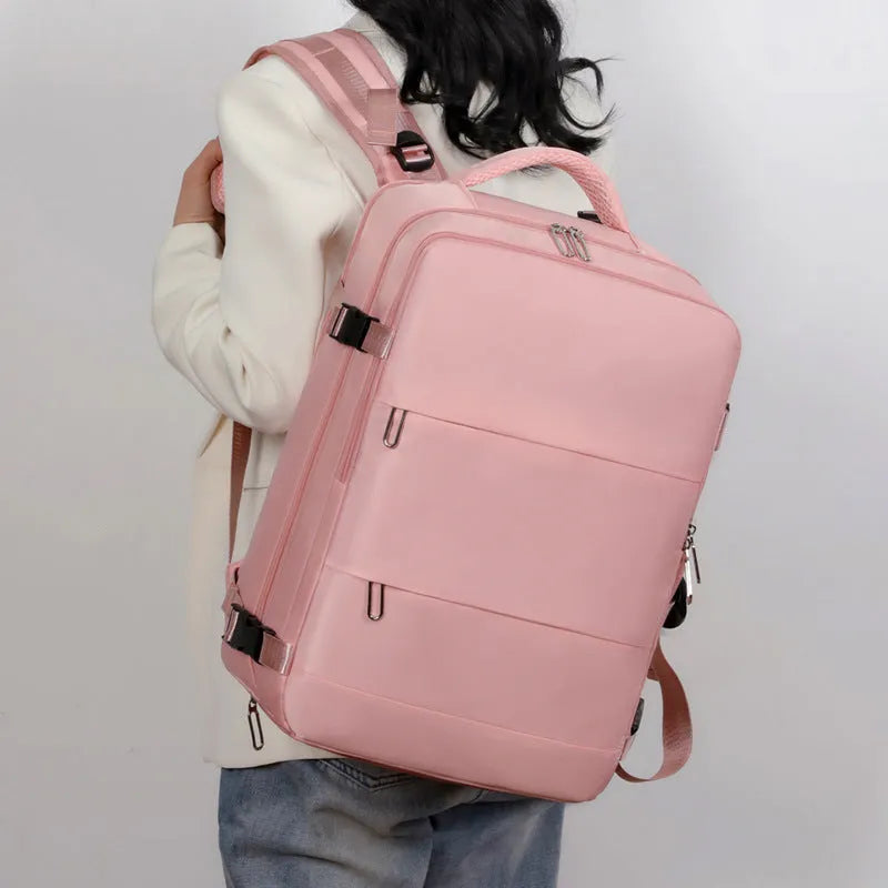 Purple large-capacity travel backpack with multiple compartments and air-pillow shoulder straps.