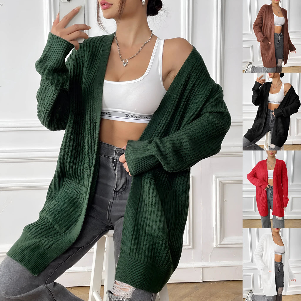 Women's dark green loose-fit cardigan sweater with two front pockets and long sleeves.