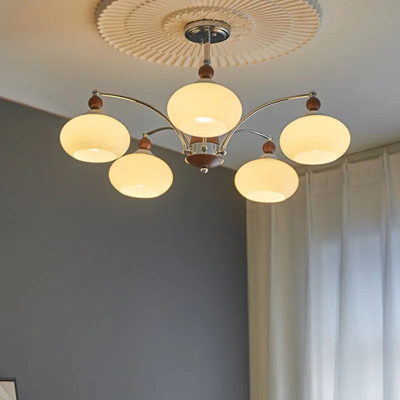 Creative persimmon glass and chrome chandelier with multiple light heads in Middle Ancient style.