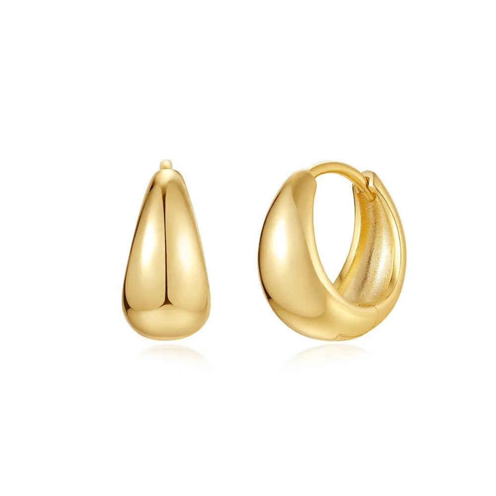 Golden geometric clip-on earrings with round design elements and electroplated finish