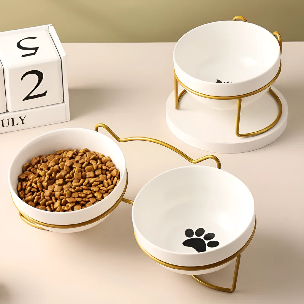 White ceramic cat bowl with iron frame in cat footprints design
