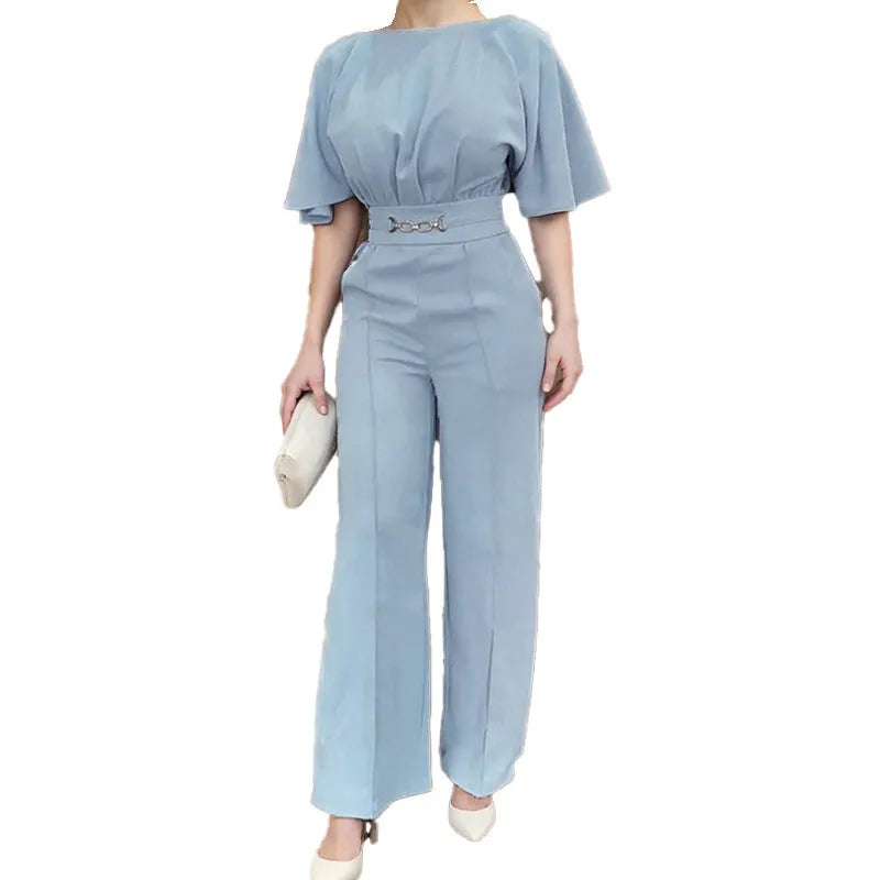 Blue men's slim fit polyester suit set with trousers and long sleeve jacket on a hanger