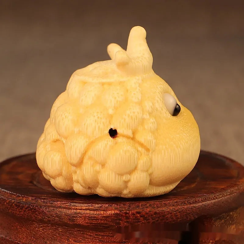 Hand-carved bamboo ornament of a cute Crown Princess toad with live eye detail