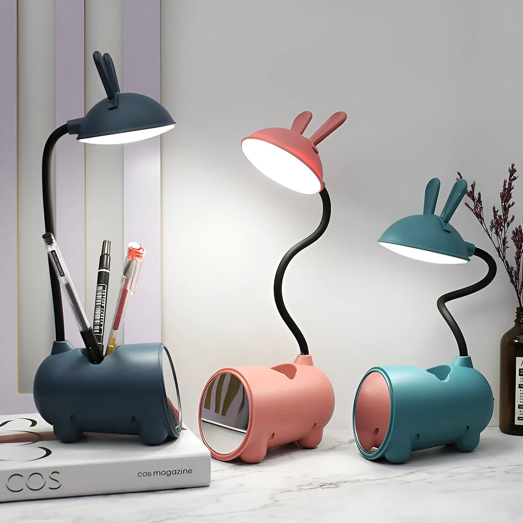 Cartoon-themed USB table lamp with pen container in green, dark blue, or pink plastic