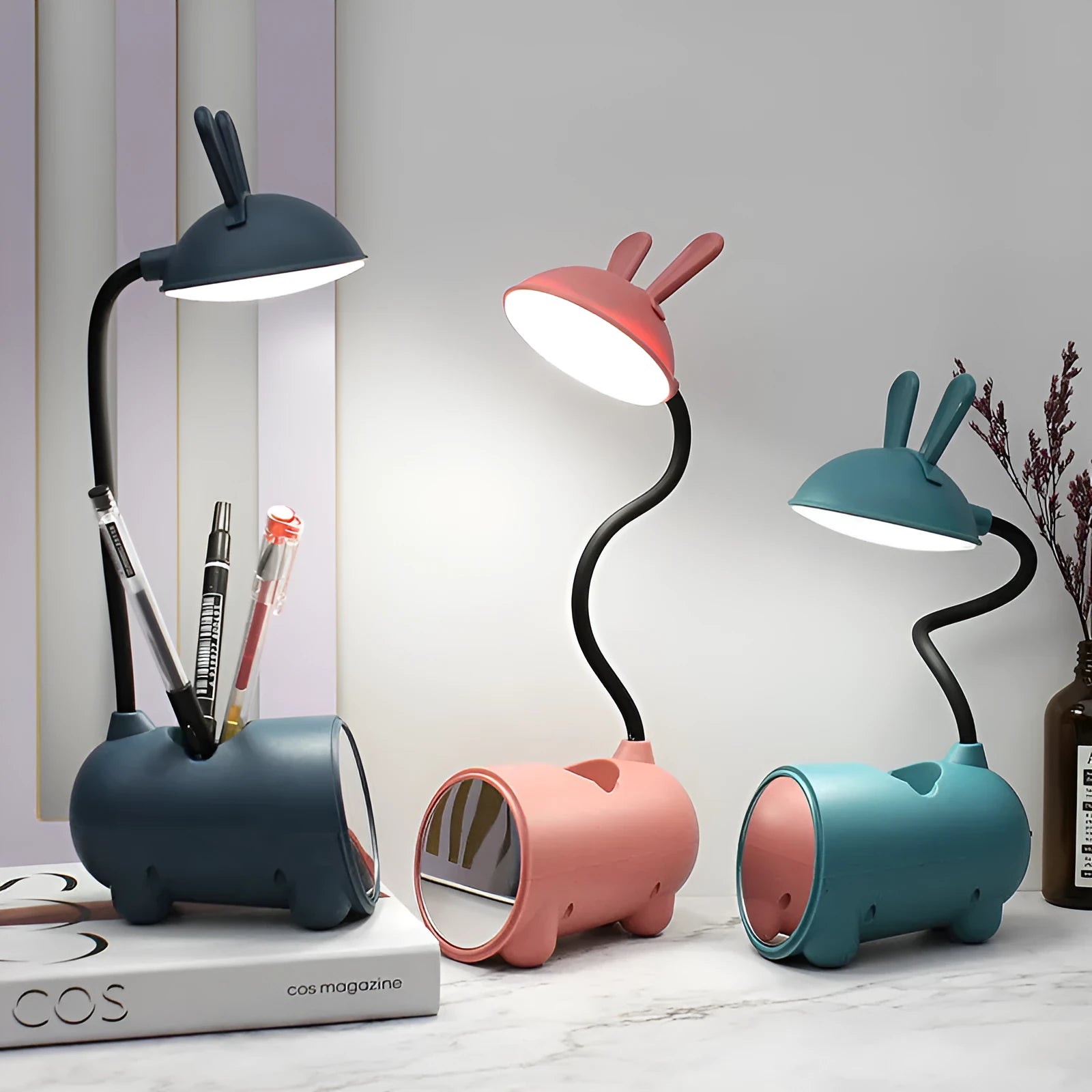 Cartoon-themed USB table lamp with pen container in green, dark blue, or pink plastic