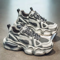 Men's black mesh sneakers with platform sole, lace-up front, and white rubber tread.