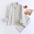 Women's cotton gauze long-sleeved pyjama set with trousers in a striped or small fruit print pattern.