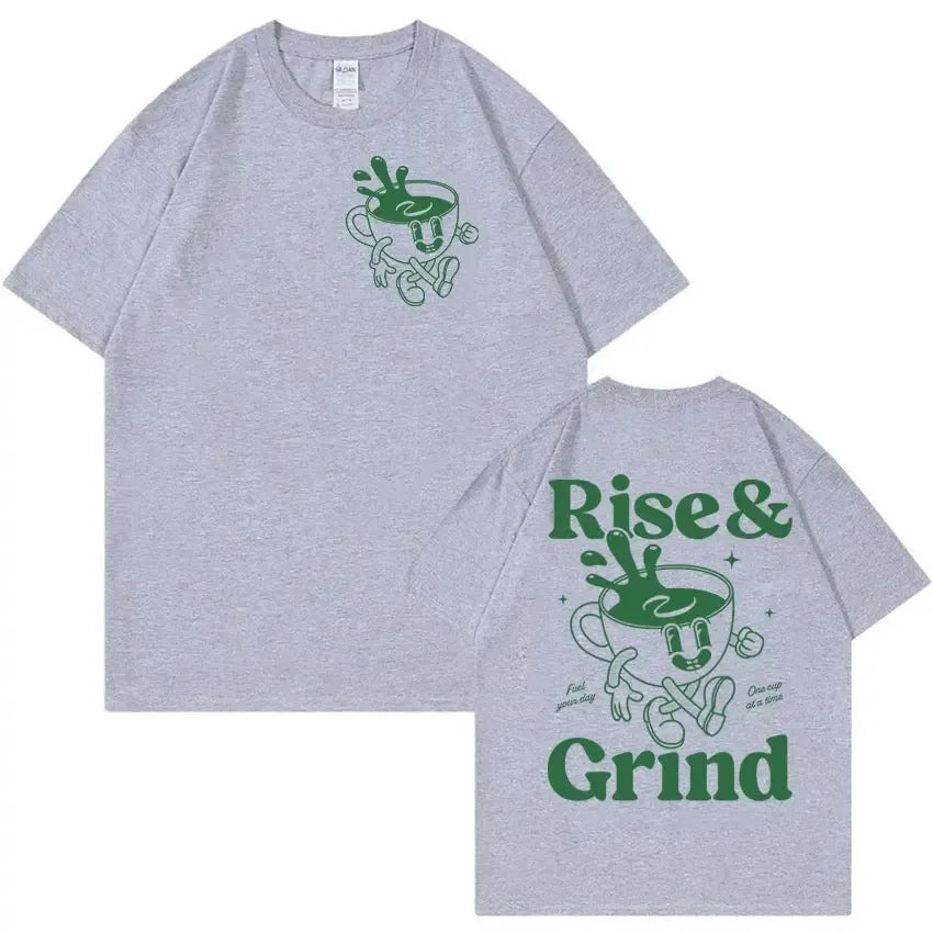 Man wearing a black loose-fit t-shirt with a green 'Rise And Grind' coffee cartoon graphic on the front.