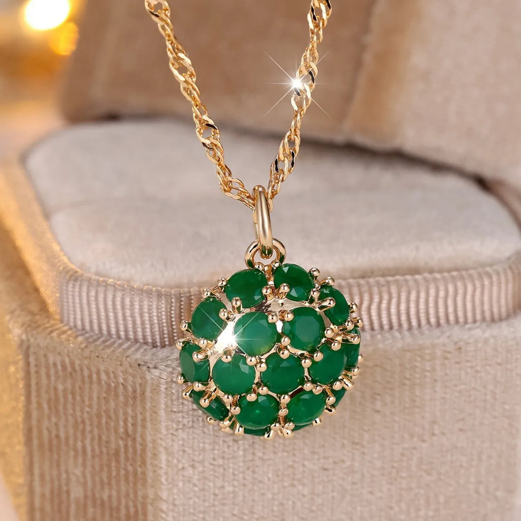 Golden green jade diamond women's necklace with round emerald pendant on an adjustable chain.