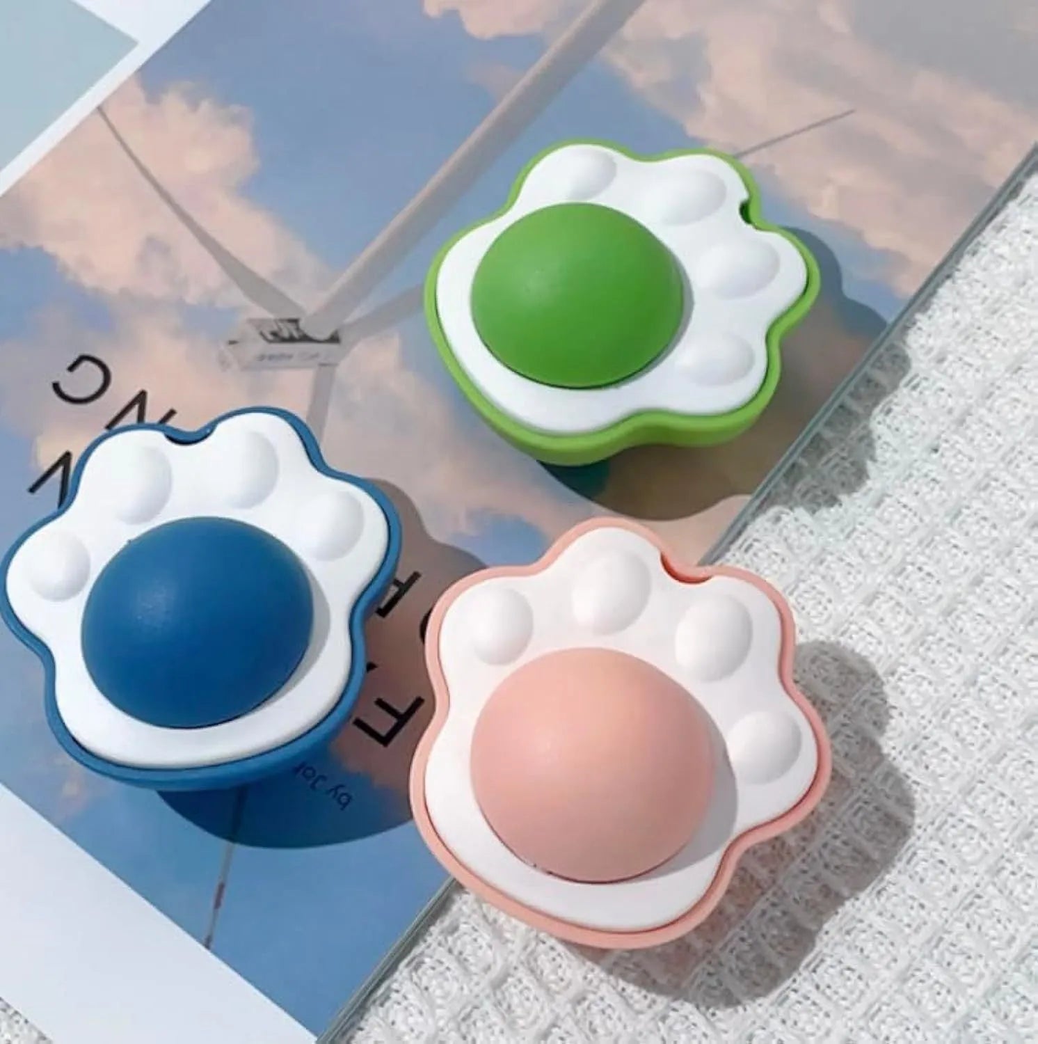 Blue, green, and pink natural vine catnip balls for feline dental cleaning and play