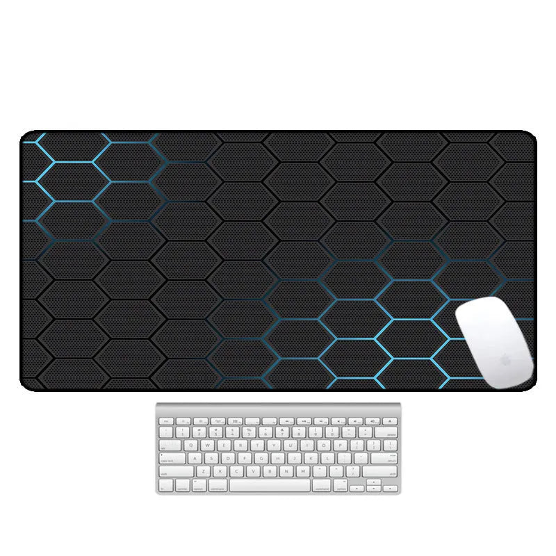 Large desk pad mouse mat with patterned design and non-slip natural rubber base on a wooden desk.