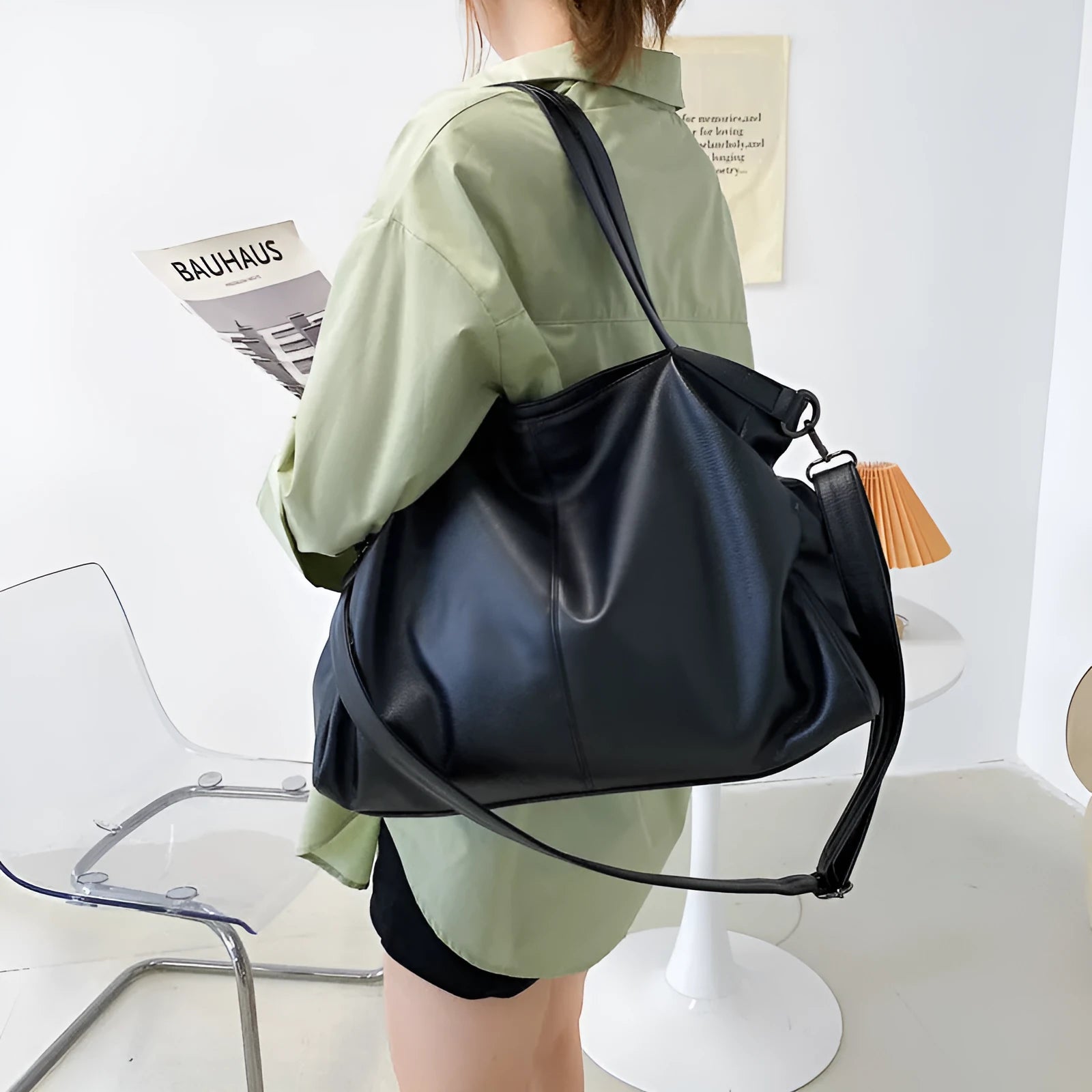 Soft surface large messenger tote bag in black with zipper opening and adjustable shoulder strap