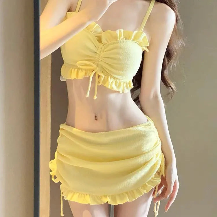 Women's milk silk bikini swimsuit in black, pitaya red, or yellow, showing two-piece split style.