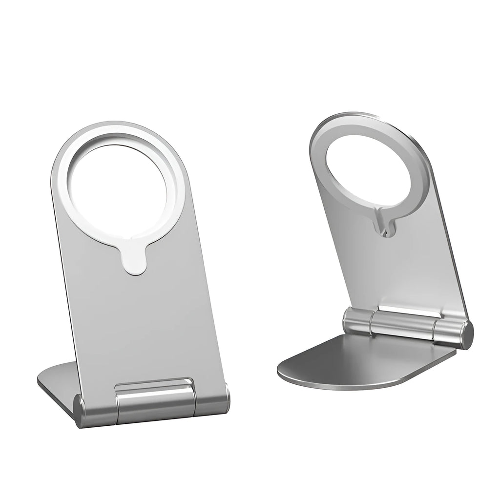 Silver vertical adjustable magnetic phone bracket for iPhone 12 models on a desk.