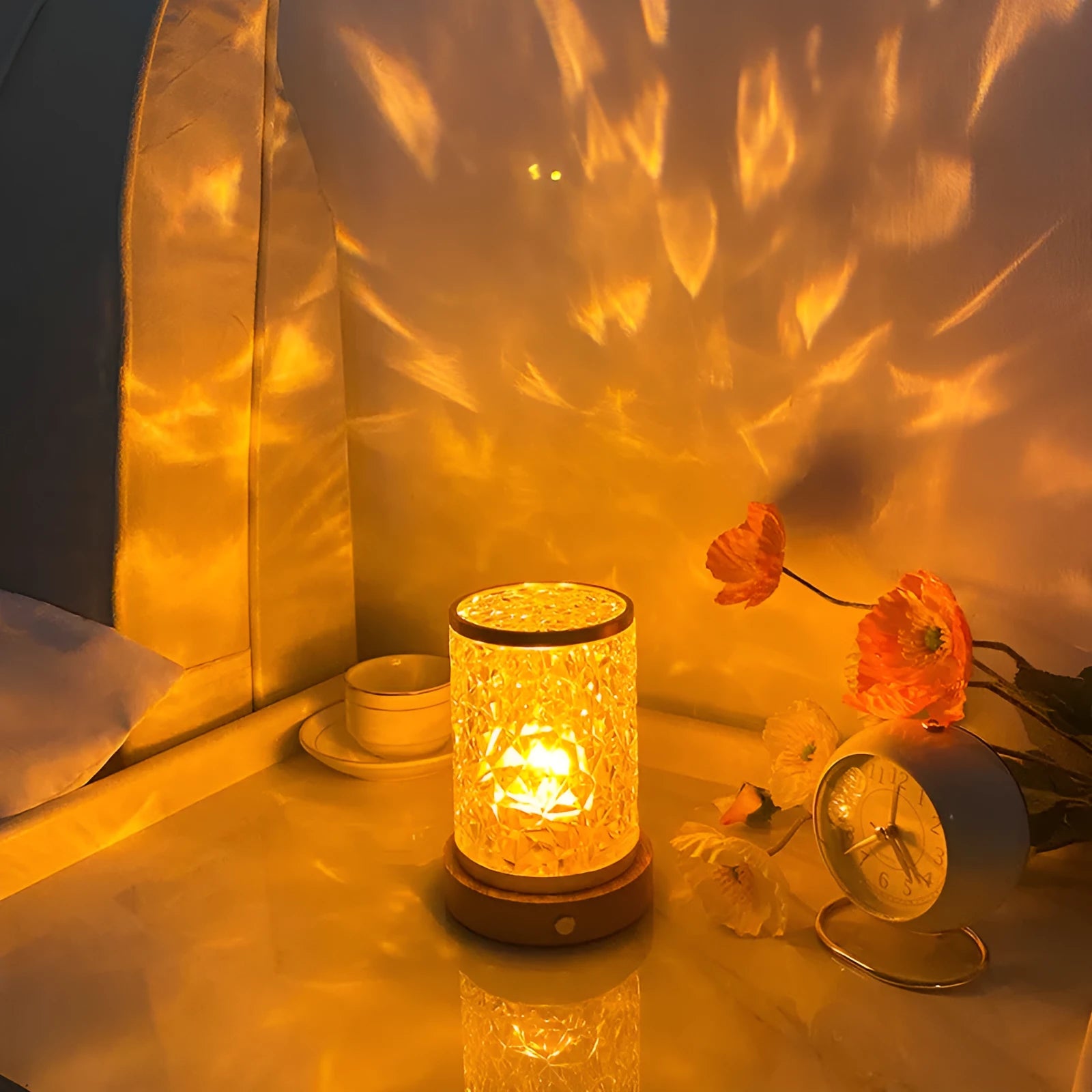 Rotating water ripple effect night light with clear acrylic body on a solid wood base.
