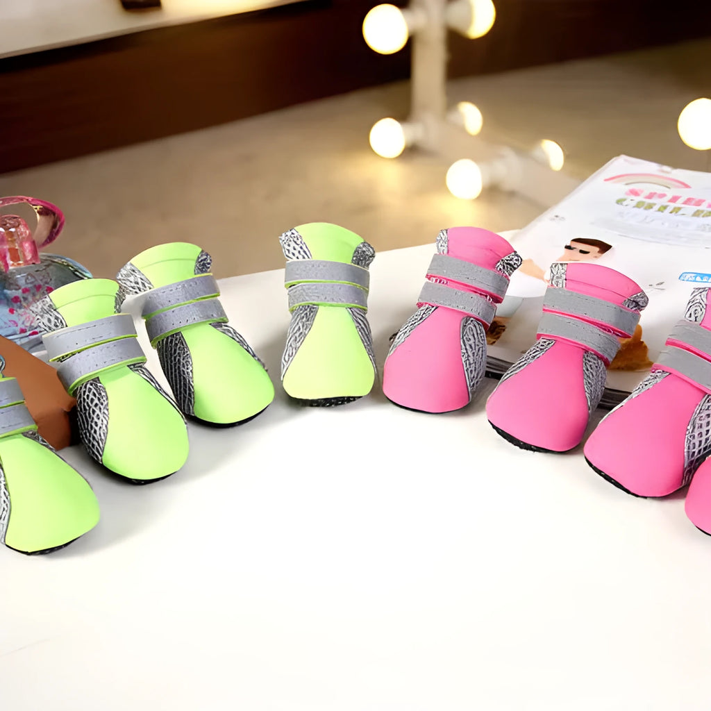 Teddy dog shoes in pink with diving fabric upper, reflective straps, and rubber sole on outdoor grass