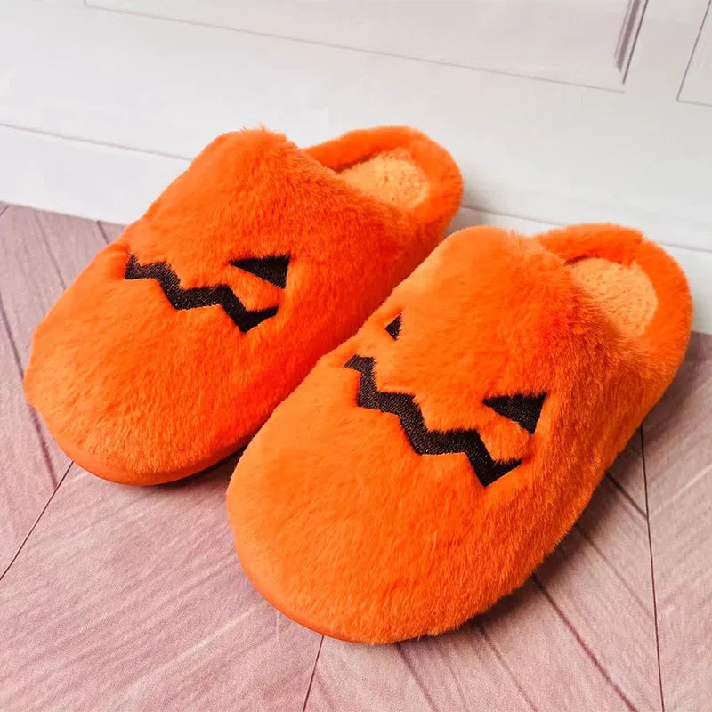 Orange Halloween pumpkin slippers with plush lining and textured PVC sole.