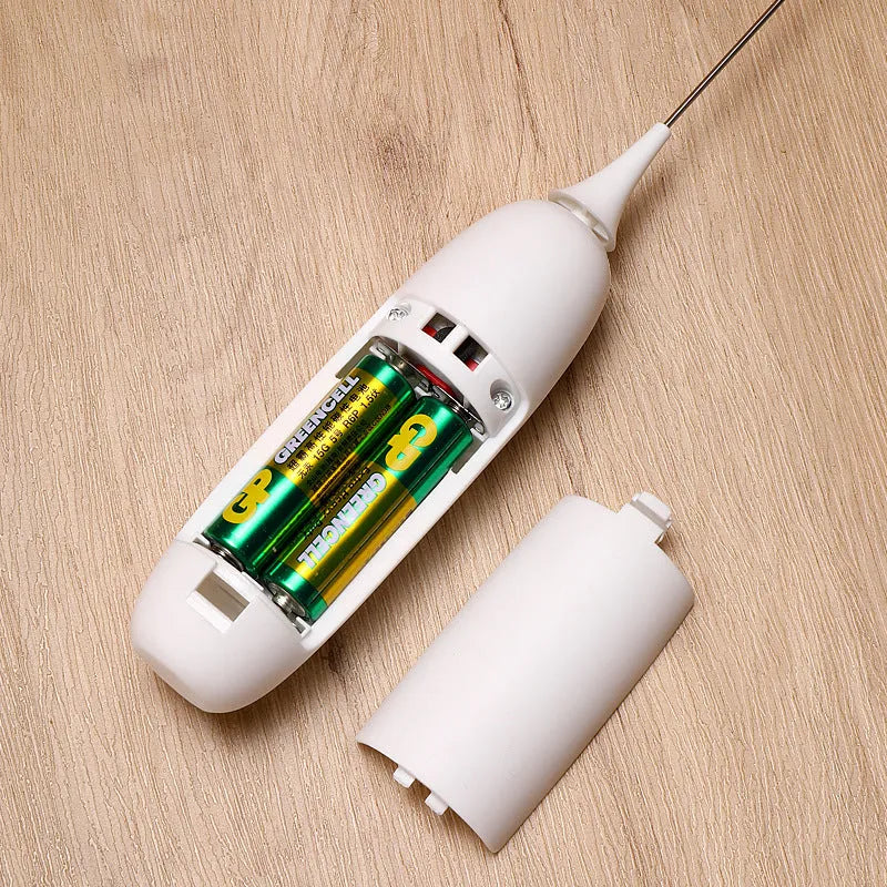 Black and white hand-held electric milk frother blender for coffee preparation