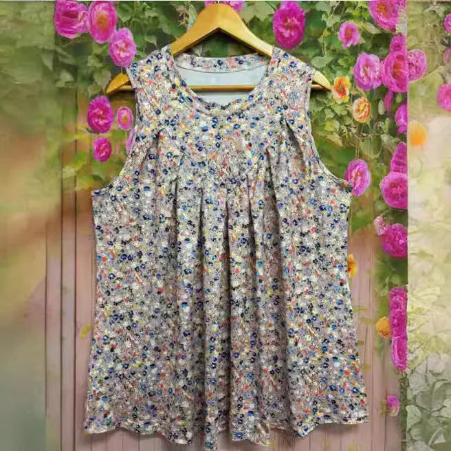 Black plus size women's floral print sleeveless vest with round neck on a hanger.