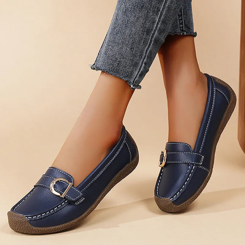 Women's beige casual loafers with a round toe and flat soft sole.