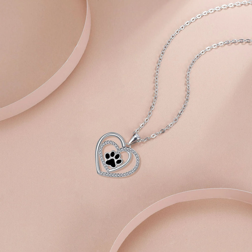 Women's copper dog paw heart pendant necklace on cross chain, electroplated finish.