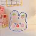Square transparent acrylic storage box with decorative character design for desk organisation