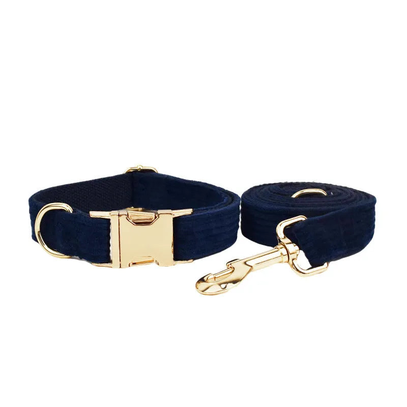 Navy blue corduroy dog collar leash set with bow, vest, and poop bag on white background