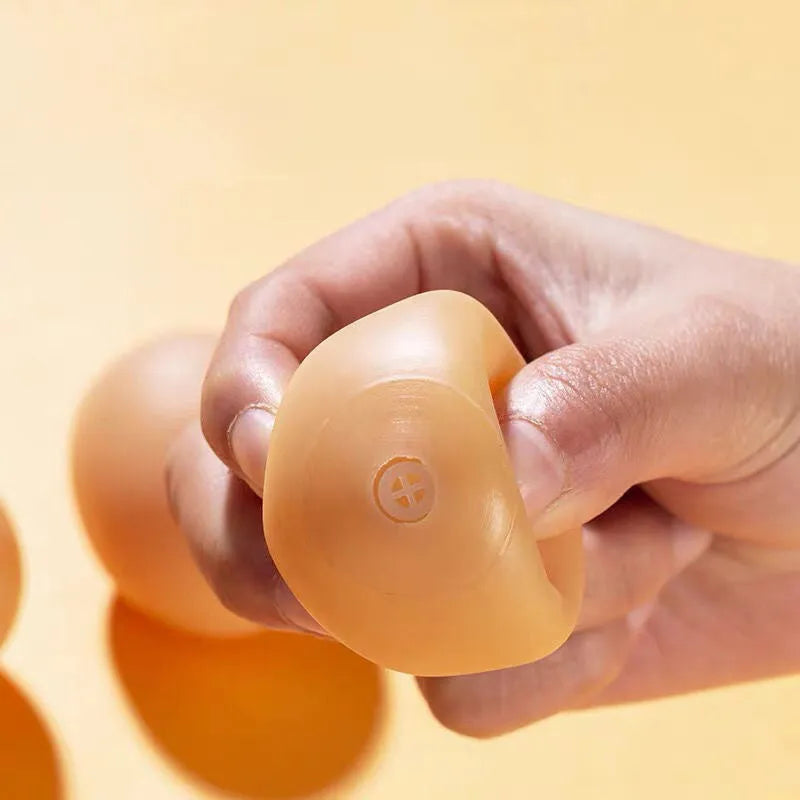 Egg-shaped dog toy with sound simulation for teeth cleaning and interactive play