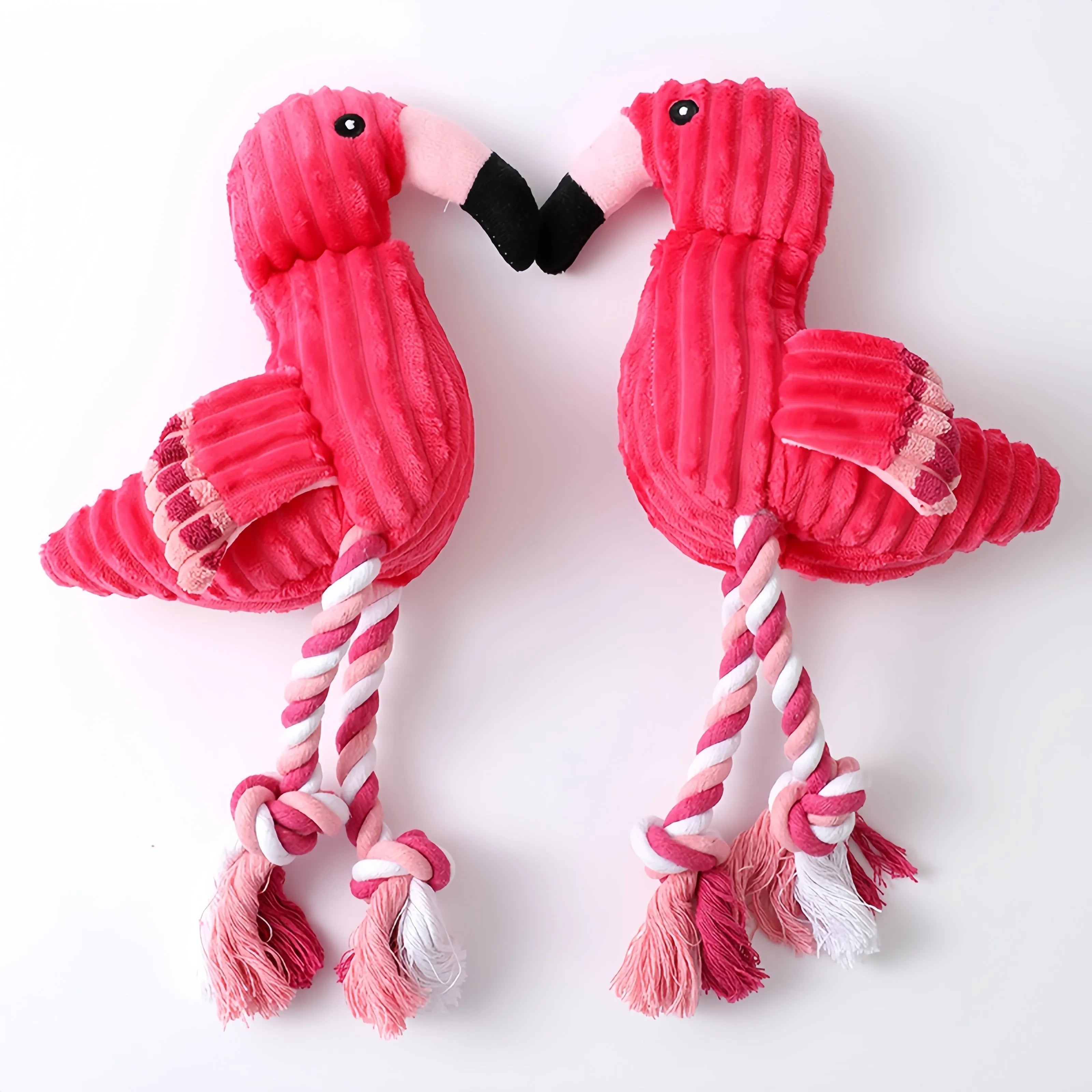Pink corduroy animal-shaped dog toy with squeaker for chewing play