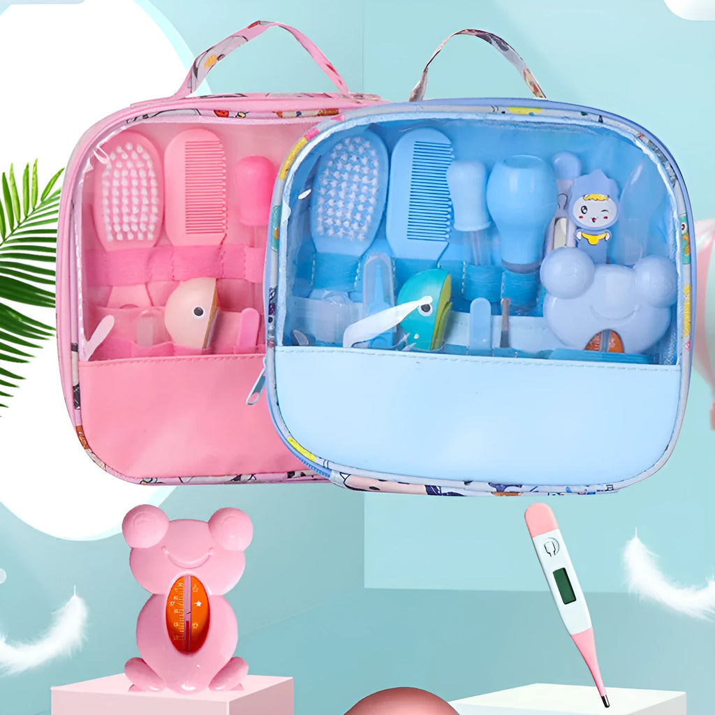 13-piece newborn baby care kit with pink grooming bag containing thermometer, scissors, brush, comb, nail clipper, and medicine tools