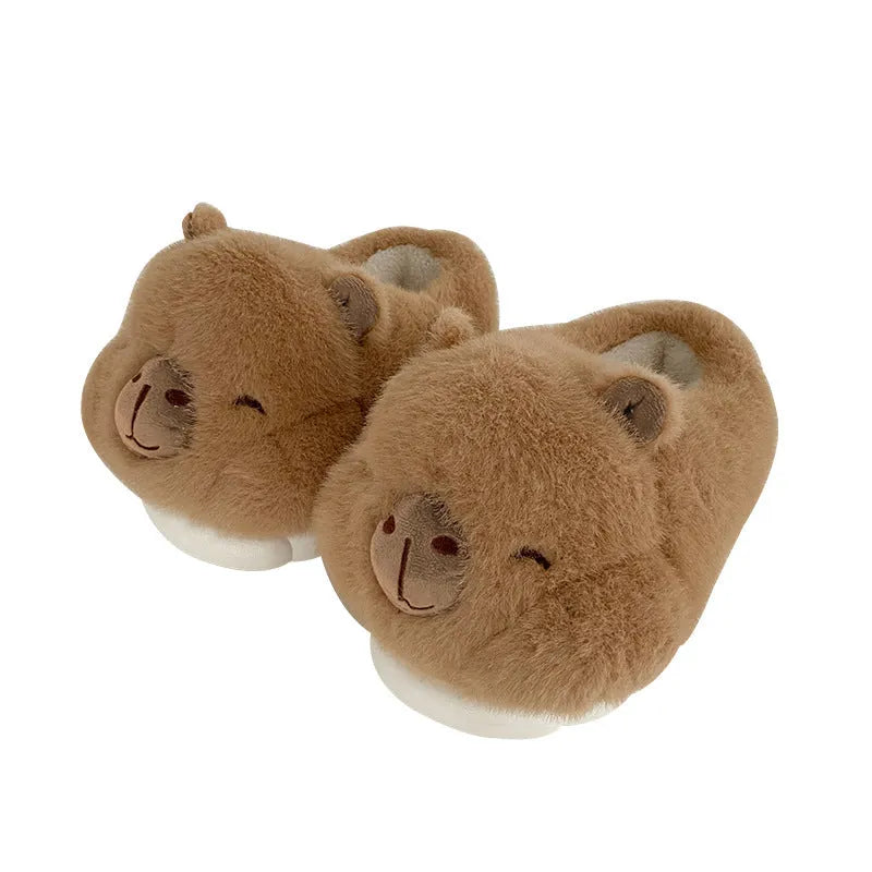 Light brown women's winter plush slippers with cartoon pattern and artificial wool lining.