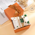 Gold green square watch with four matching bracelets, 25mm dial, jewellery buckle