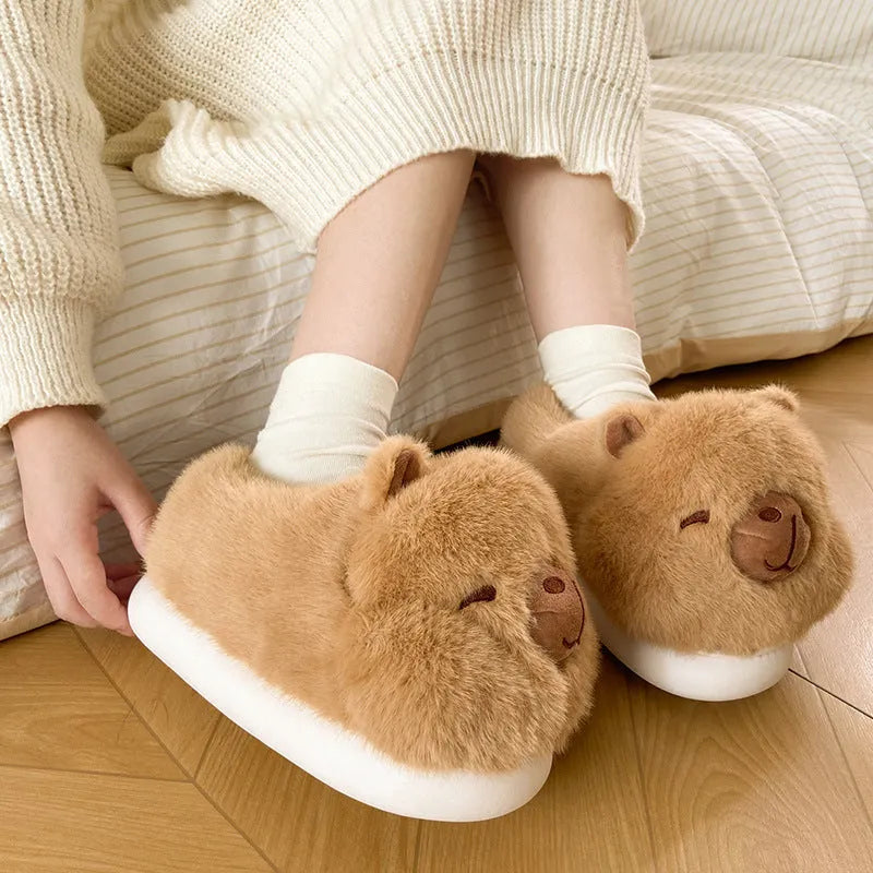 Light brown women's winter plush slippers with cartoon pattern and artificial wool lining.
