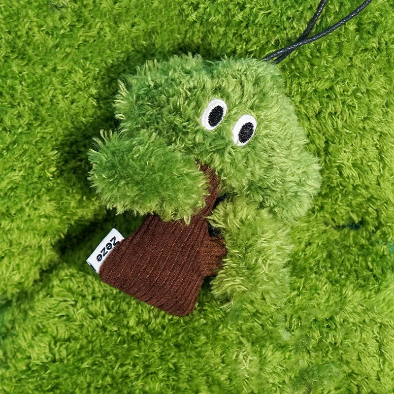 Green pine tree shaped cat toy pendant with a hanging loop, shown next to a tape measure indicating 12cm length.