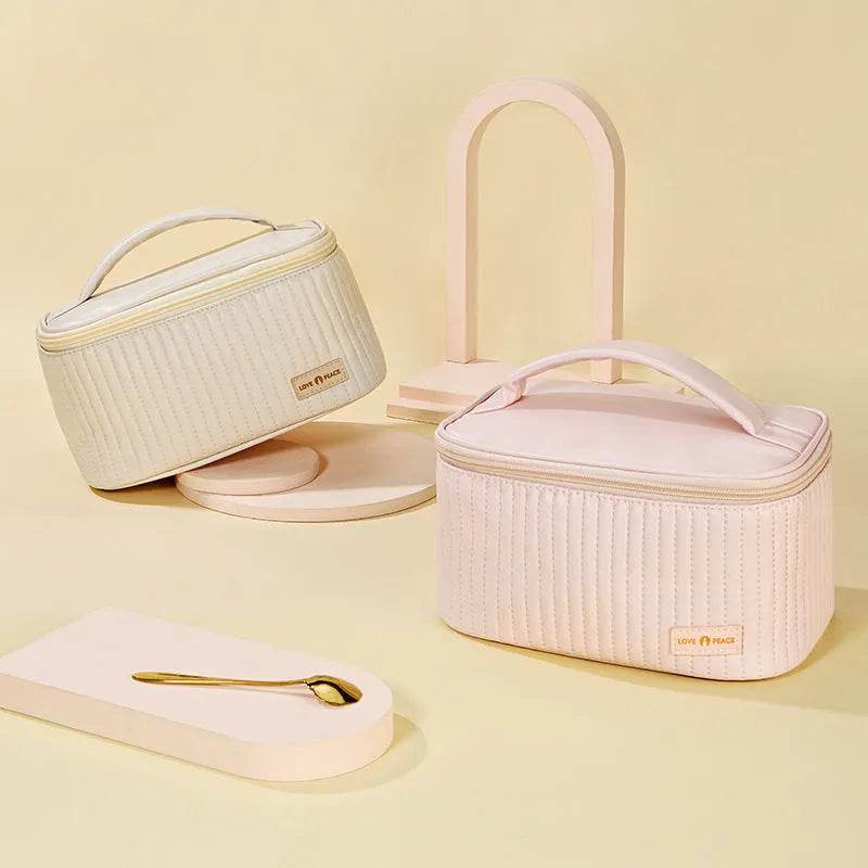 Open-top cake-shaped makeup bag in PU leather, shown in one of six available colours.