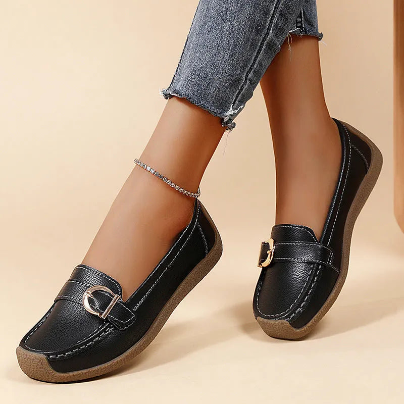 Women's beige casual loafers with a round toe and flat soft sole.