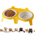 Blue ceramic cat bowl set on white elevated stand with hook, showing tilted food and water dishes.