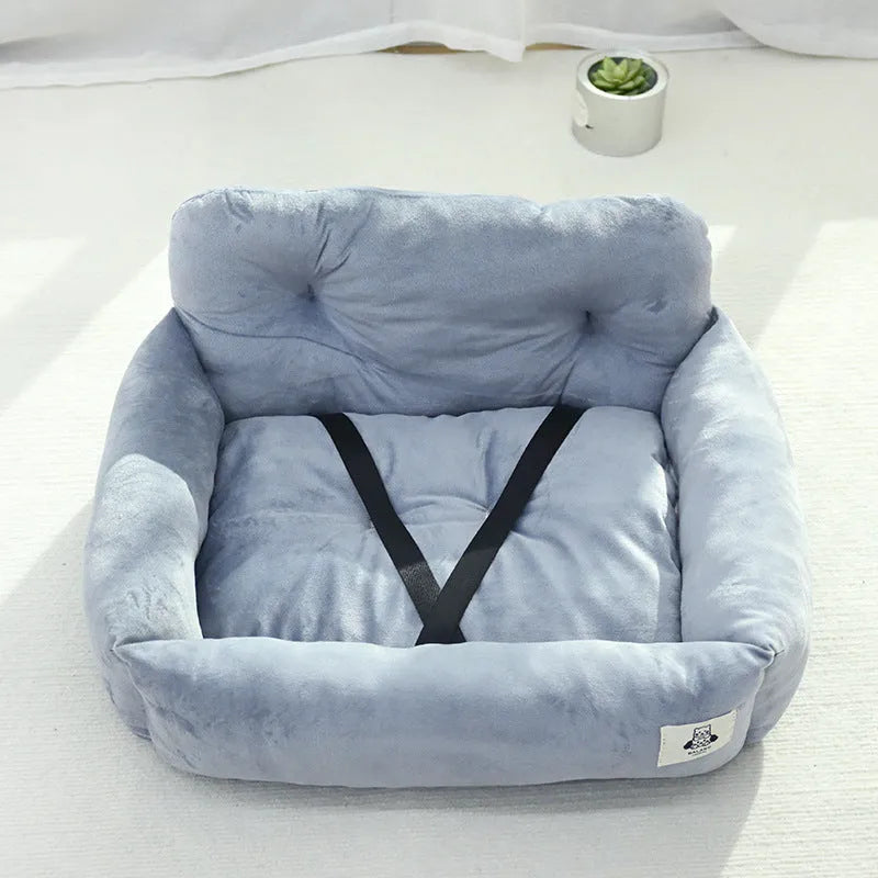 Car-mounted dog travel nest in stain-resistant cloth showing grey and blue plaid colour options