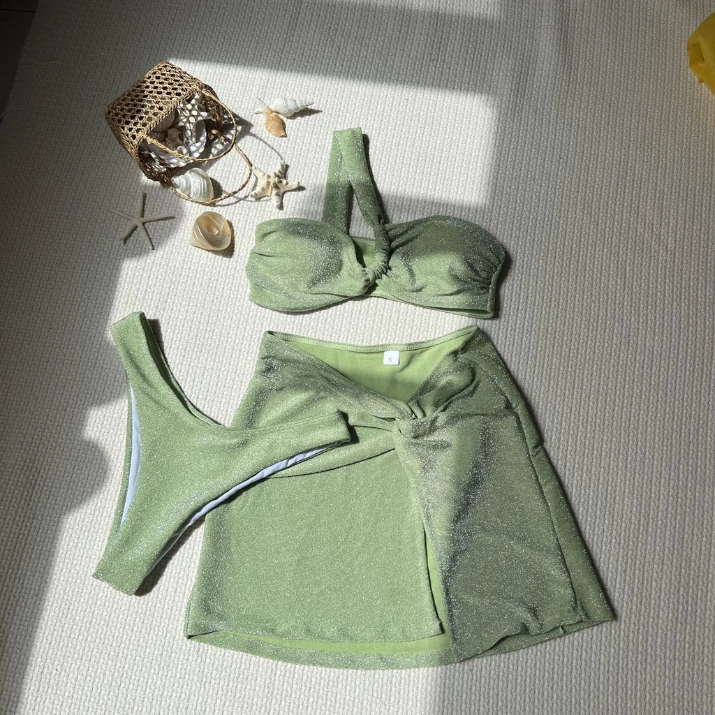 Women's light green one-shoulder swimsuit three-piece set with matching skirt