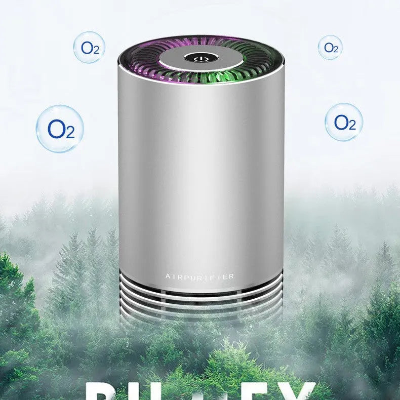 Compact black metallic car air purifier with USB cable on a car dashboard.