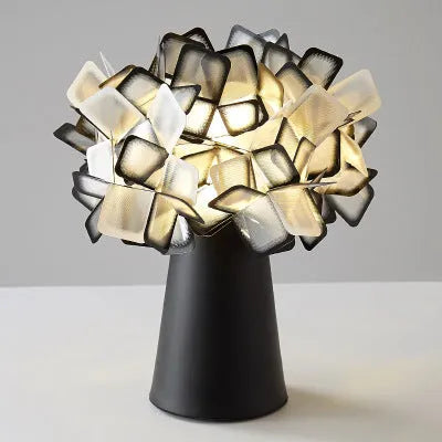 Nordic style metal table lamp in a choice of colours showing warm, white, and neutral light settings.