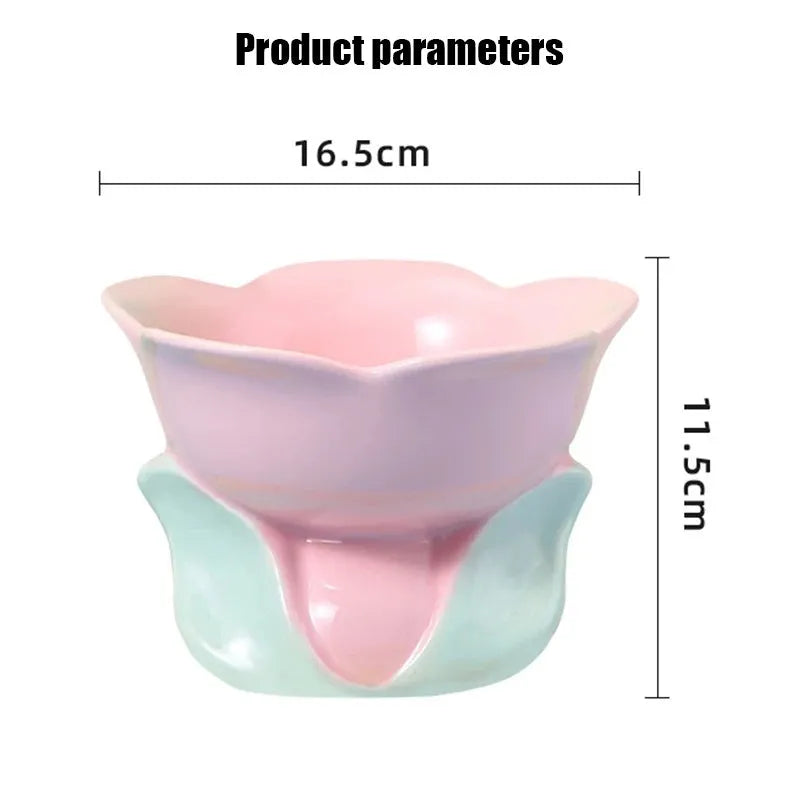 Blue floral patterned ceramic raised pet bowl for cats and dogs on a wooden floor.