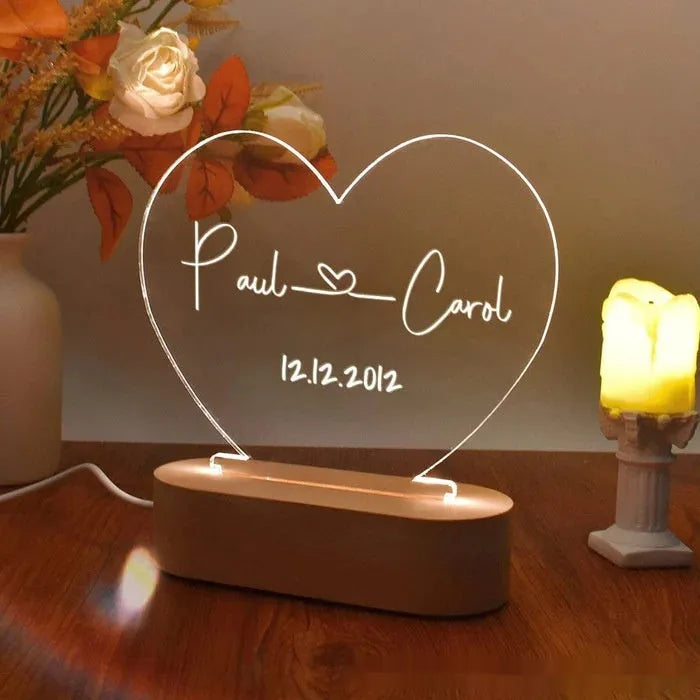 Personalised acrylic night light with engraved names and dates, measuring 20cm by 11.5cm