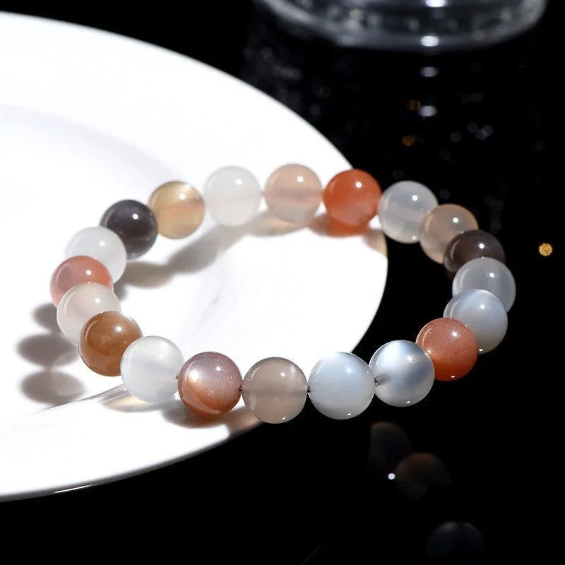 Natural moonstone bracelet with colourful light variation showing 8mm beads in single circle configuration