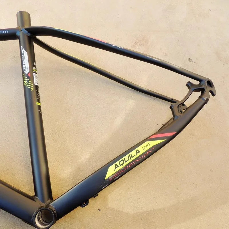 Black and green 29-inch aluminium mountain bike frame with internal cable routing