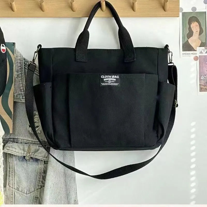 Canvas shoulder bag in khaki, 31cm wide, with handle and crossbody strap, urban simplicity style