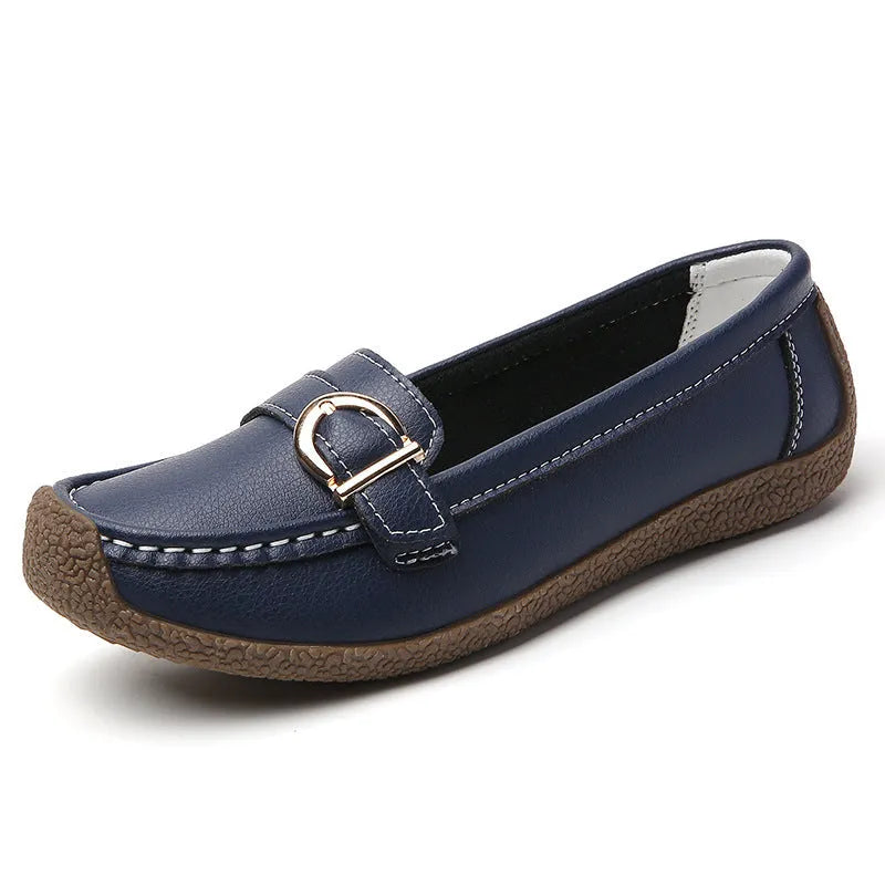 Women's beige casual loafers with a round toe and flat soft sole.