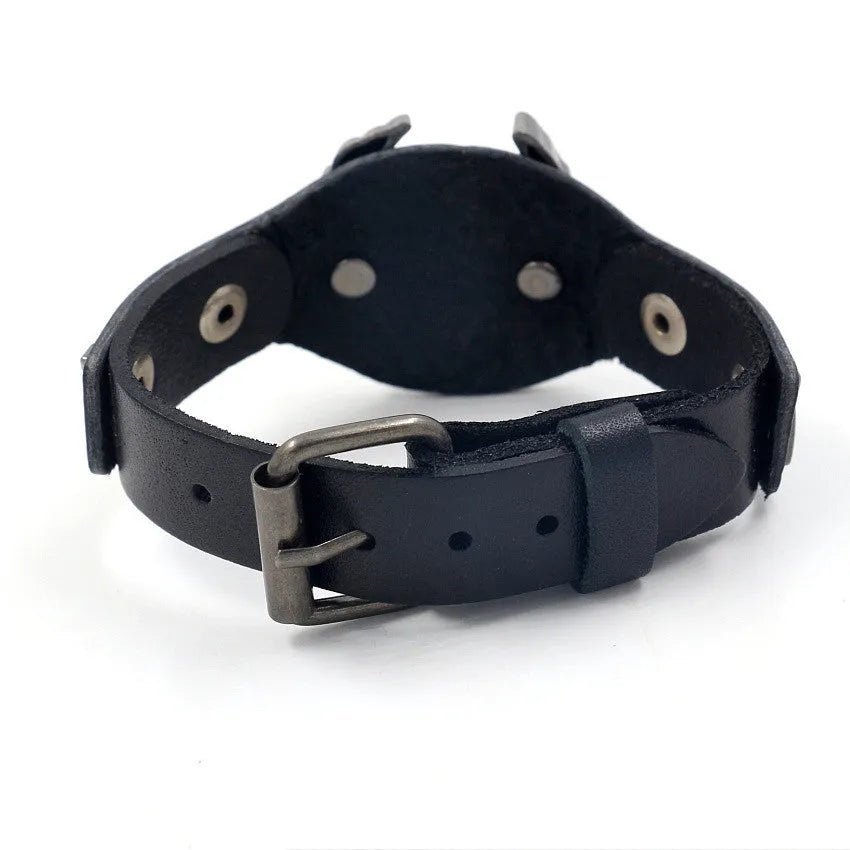 Black geometric leather bracelet with eagle watch-button clasp showing tapered width from 3.8cm to 1.7cm